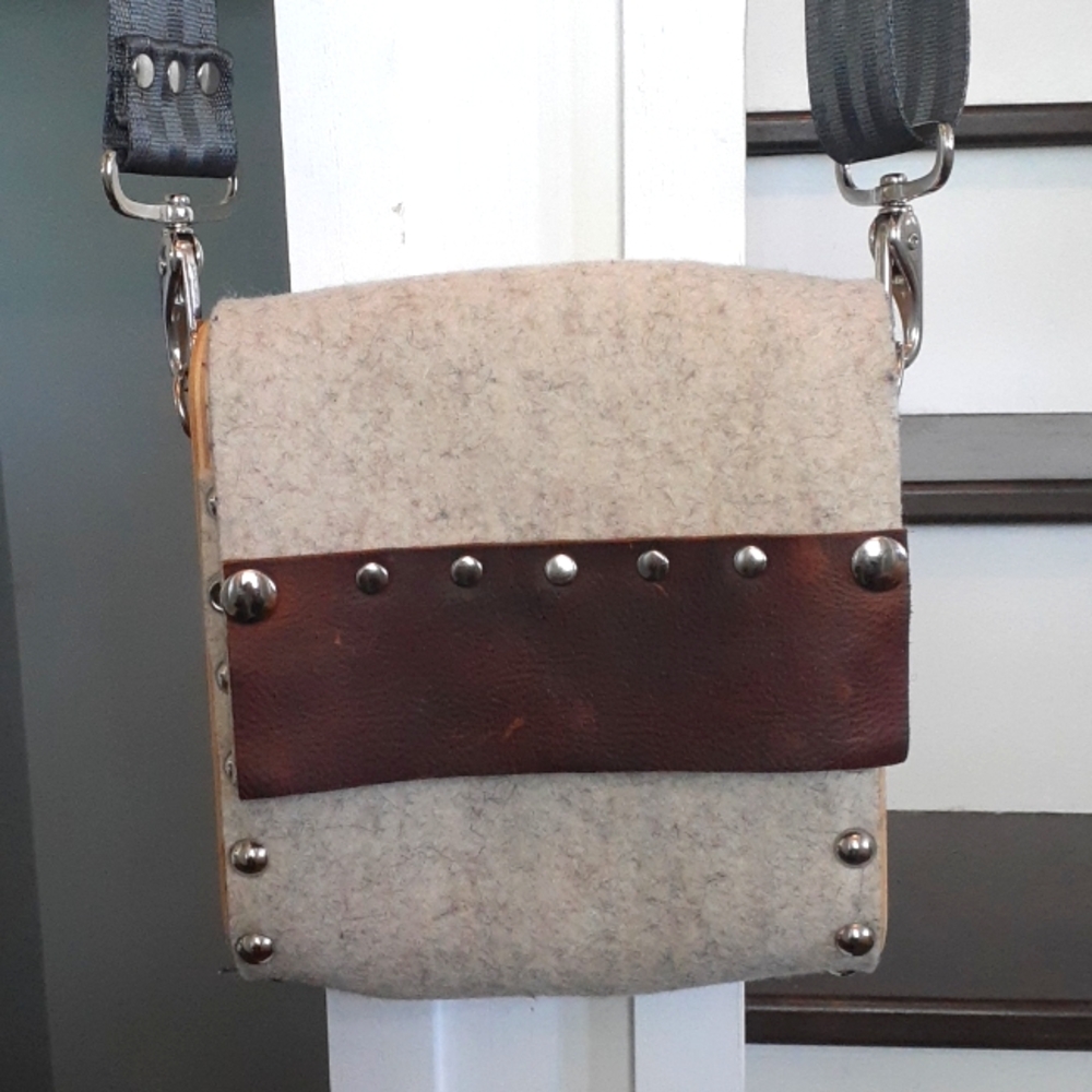 ^ SOL Designs upcycled seatbelt crossbody bag